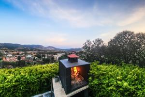 a wood fired stove with a view of a city at Vacation Flat w Garden Pool in Bodrum Gumusluk in Gumusluk