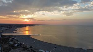 an aerial view of a beach at sunset at Hotel St Gregory Park in Rimini
