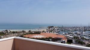a view of a marina from the balcony of a building at Hotel St Gregory Park in Rimini