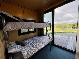 Postel nebo postele na pokoji v ubytování Waitomo Retreat + 9 fotografií
