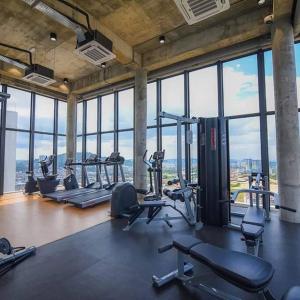 a gym with a bunch of treadmills and machines at EkoCheras Residences Van Gogh theme design with MRT Cheras in Kuala Lumpur
