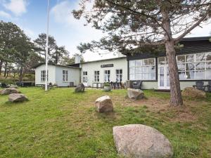 a house with rocks in front of it at Holiday home Gilleleje XV in Gilleleje
