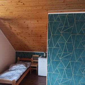 Postel nebo postele na pokoji v ubytování Wzgórze Baranów