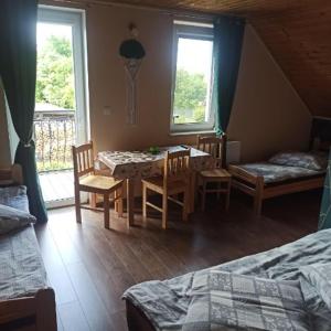 Postel nebo postele na pokoji v ubytování Wzgórze Baranów