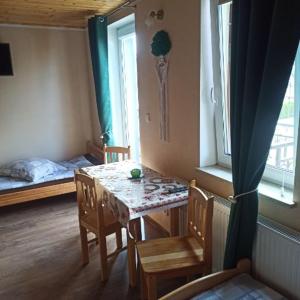 Postel nebo postele na pokoji v ubytování Wzgórze Baranów