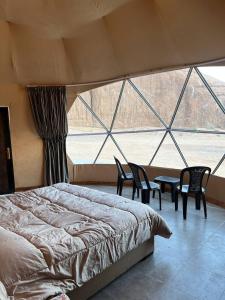 Postel nebo postele na pokoji v ubytování Wild Oryx Camp Bubbles