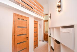 a hallway with a wooden door in a house at Comfortable Apartament on the Boulevard for 4 people in Budapest