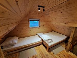 Postel nebo postele na pokoji v ubytování Agroturystyka Skoszewo