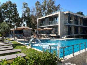 a swimming pool with a water slide in front of a building at ARCADIA of BODRUM in Bodrum City