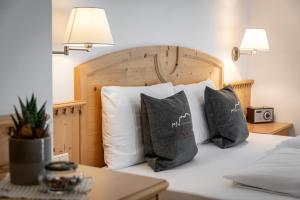 Postel nebo postele na pokoji v ubytování Hotel Dosses