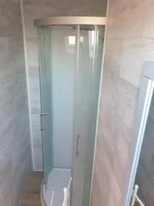 a shower with a glass door in a bathroom at Les Géraniums Sullylois in Sully-sur-Loire +6 photos
