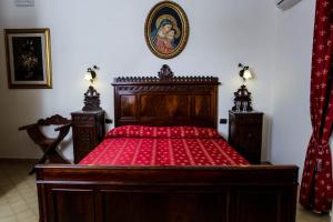 A bed or beds in a room at La Quercia Antica B&B