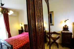 A bed or beds in a room at La Quercia Antica B&B