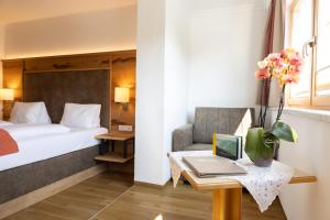 Postel nebo postele na pokoji v ubytování Aparthotel DAS Hochkönig