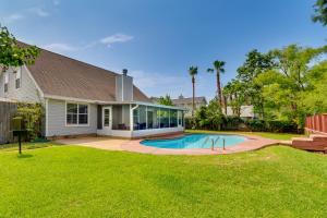 a house with a swimming pool in a yard at Mary Esther Home with Private Pool and Fireplace! in Mary Esther