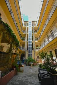 a courtyard of a building with a fountain in it at Comfortable Apartament on the Boulevard for 4 people in Budapest