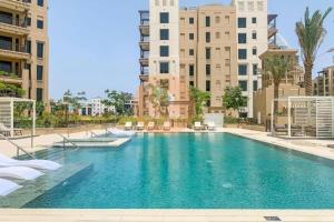 a swimming pool in the middle of a building at EasyGo - Lamtara 1 Burj Al Arab 2 Bedroom & Maid in Dubai