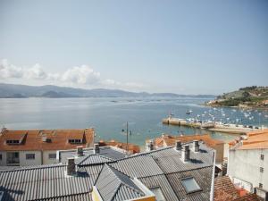 a view of a harbor with boats in the water at Ático Pampaído in Raxó
