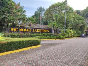 a sign that reads hit miami lakeatown in a park at Sofea Inn Bukit Merah - Laketown D6529 in Kampong Selemat