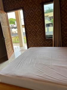 Postel nebo postele na pokoji v ubytování Gihon Bungalow