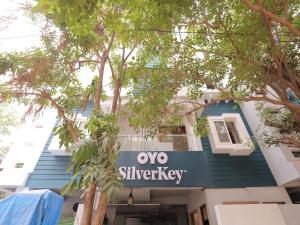 a building with a sign that reads ox silkyeway at Silverkey Executive Stay in Yelahanka
