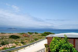 a view of the ocean from a house at Maria’s Sunset House in Megalochori