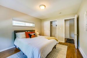 a bedroom with a large bed and a window at Wyandotte Vacation Rental Apartment Near Hospital! 