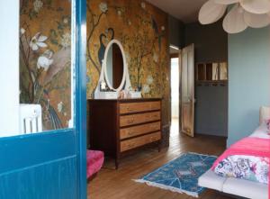 En eller flere senge i et værelse på Villa « LA CHARMANTE »