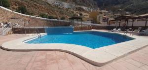 a swimming pool in the middle of a building at Mirador de aguadulce in Aguadulce