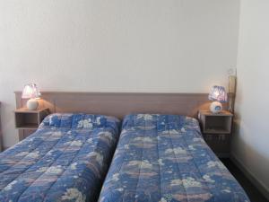 Ένα ή περισσότερα κρεβάτια σε δωμάτιο στο Auberge de l'Arzon