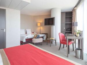 Postel nebo postele na pokoji v ubytování Mercure Clermont Ferrand centre Jaude