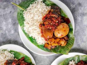 a plate of food with rice and meat and vegetables at Carlson Hotel, Osborne Foreshore Phase 2, Ikoyi in Lagos
