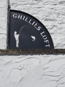 a sign on the side of a building at Salutation Inn in Carmarthen