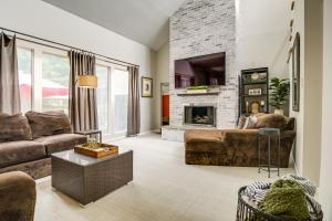 a living room with a couch and a fireplace at Inviting Lancaster Vacation Home 3 Mi to Downtown in Lancaster