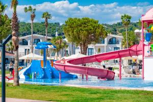 a water park with a slide in the water at Benata Hotel Ultra All Inclusive in Manavgat
