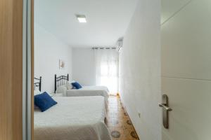 Postel nebo postele na pokoji v ubytování Apartamento Estudio Acuario Frente Mar
