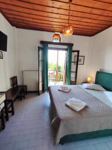 Posteľ alebo postele v izbe v ubytovaní Hotel Vrionis