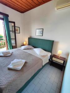Posteľ alebo postele v izbe v ubytovaní Hotel Vrionis