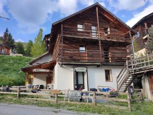 a log house with a sign in front of it at Õ 2040 in Saint-Véran