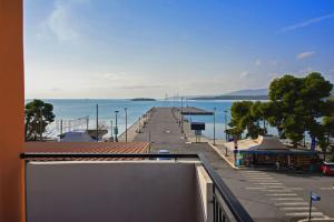 a view of a pier with the ocean in the background at Modern, Stylish Maisonette in Itea