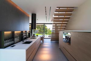 a kitchen with a staircase leading to a room at Villa Casa Palmera in Ixia