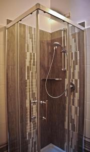 a shower in a bathroom with a glass door at B&B La Voce della Luna in San Vito Chietino