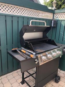 a bbq grill sitting on a patio at Motel ANF in Drummondville
