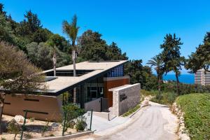 a house on the side of a dirt road at Villa Casa Palmera in Ixia