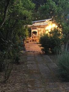 a small house in the middle of a garden at Le Terrazze di Gio in Sennori