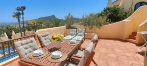 a table and chairs on a patio with a view at La Manga Club Los Altos 1 in Atamaría