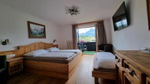 Postelja oz. postelje v sobi nastanitve Hotel Garni Zimmermann