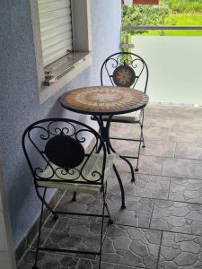 a table and two chairs sitting on a patio at Ferienwohnung Familie Wieser in Liebenfels