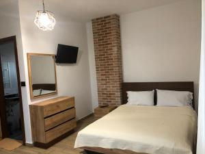 Postel nebo postele na pokoji v ubytování Vila Ilo