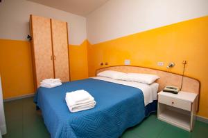 Postel nebo postele na pokoji v ubytování Hotel Montebello Riccione